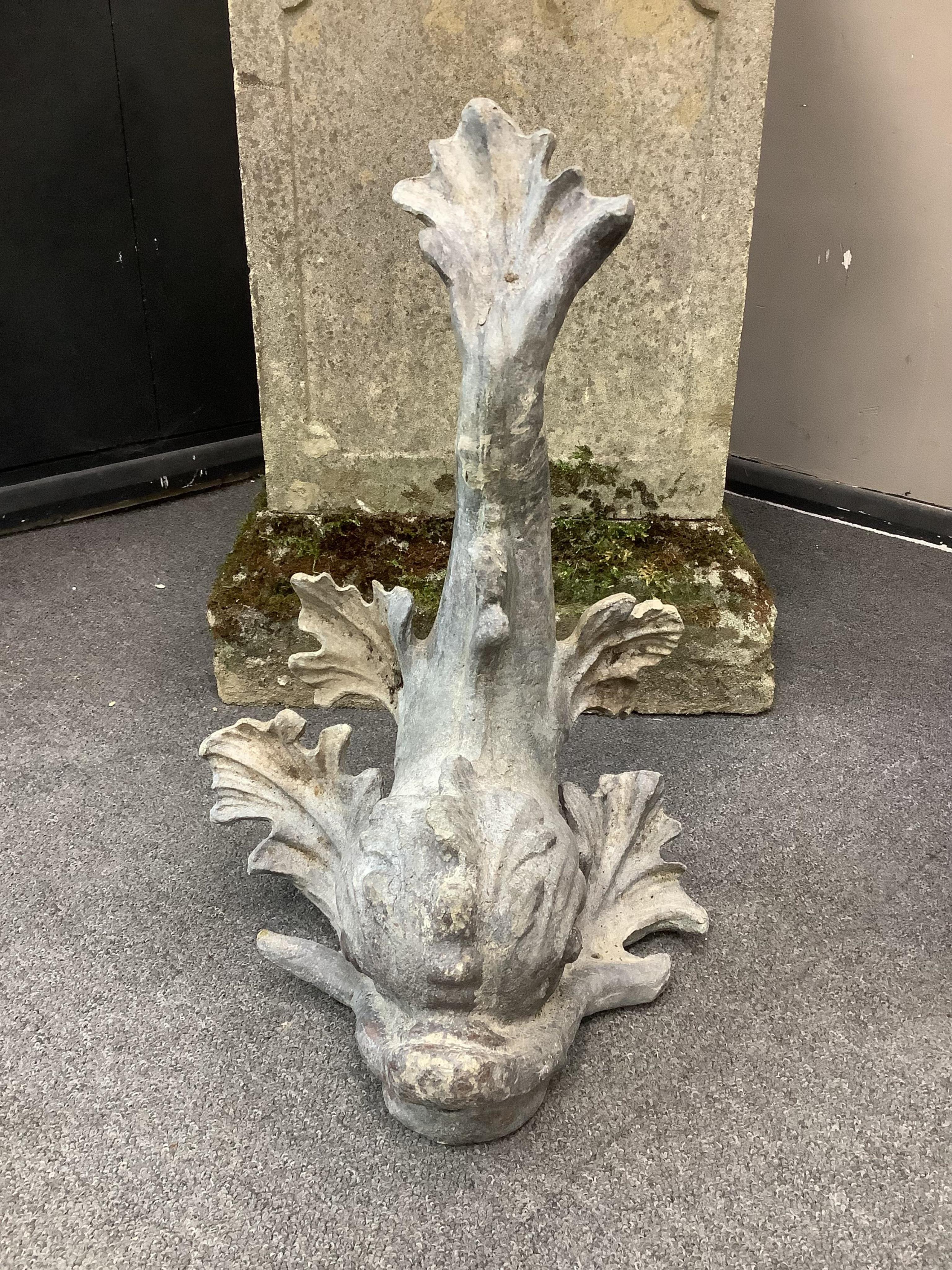 A 19th century lead dolphin fountain head, height 48cm. Condition - fair